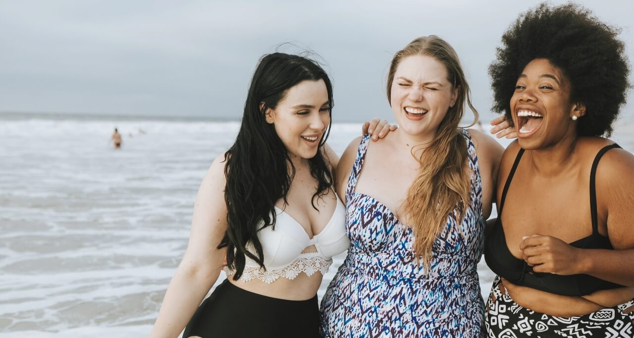 cheerful-plus-size-women-enjoying-the-beach-2022-12-16-00-17-33-utc